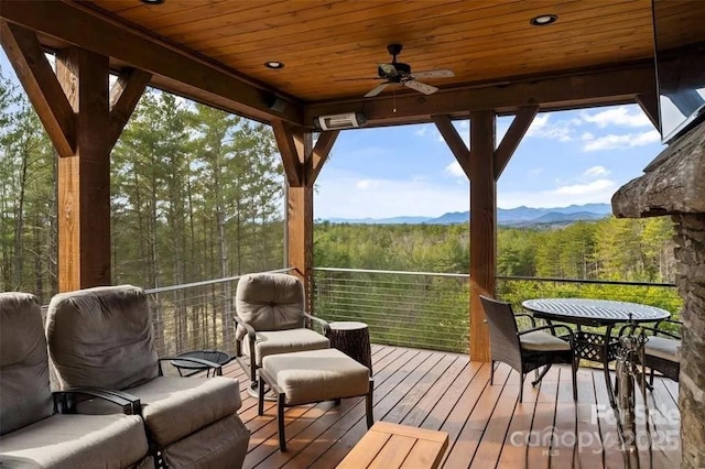 2775 Campbells Trce, Nebo, NC 28761 - wooden terrace featuring a view of trees, ceiling fan, and a mountain view