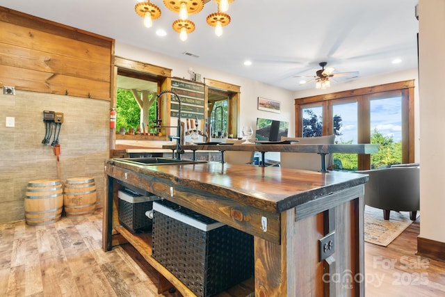 2775 Campbells Trce, Nebo, NC 28761 - kitchen with light wood-style flooring, a ceiling fan, recessed lighting, an office area, and a chandelier