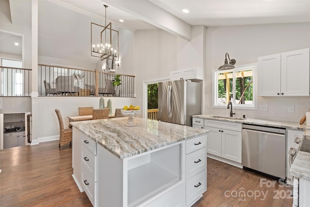 1096 Palmyra Dr, Tega Cay, SC 29708 - kitchen featuring stainless steel appliances, high vaulted ceiling, a chandelier, backsplash, and a kitchen island