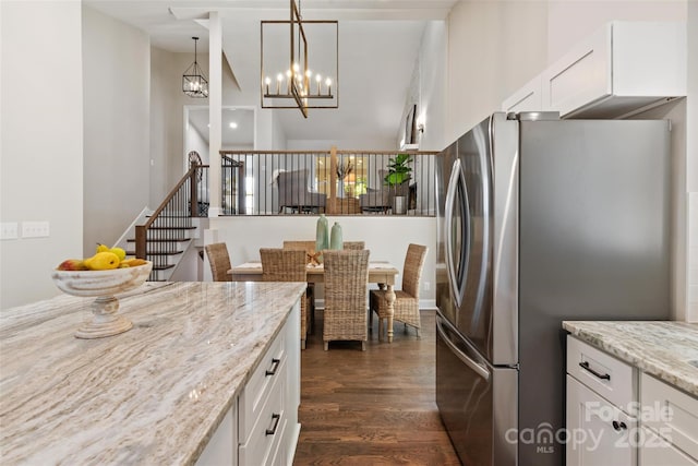 1096 Palmyra Dr, Tega Cay, SC 29708 - kitchen featuring freestanding refrigerator, high vaulted ceiling, white cabinets, dark wood-style floors, and light stone counters