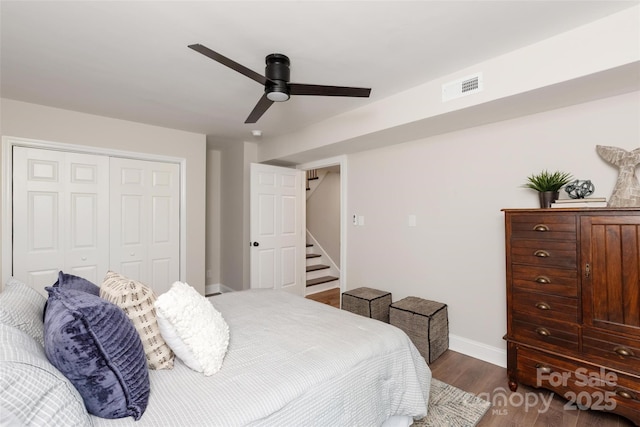 1096 Palmyra Dr, Tega Cay, SC 29708 - bedroom featuring dark wood-style flooring, a closet, and a ceiling fan