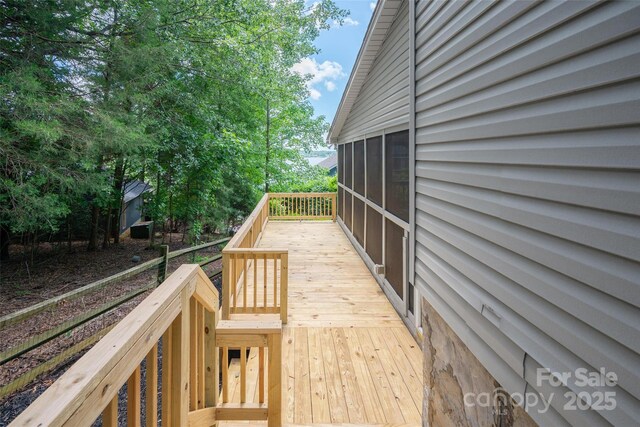 1096 Palmyra Dr, Tega Cay, SC 29708 - wooden deck with a sunroom