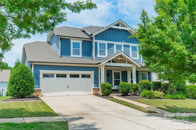 12107 Grey Partridge Dr, Charlotte, NC 28278 - craftsman-style house featuring board and batten siding, concrete driveway, a porch, roof with shingles, and a front lawn