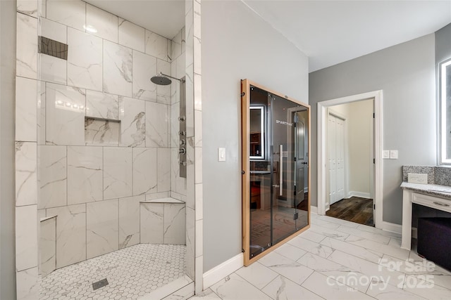 3911 Sandy Point Dr, York, SC 29745 - bathroom with tiled shower, marble look tiles, vanity, and baseboards