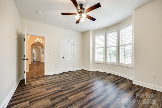 3911 Sandy Point Dr, York, SC 29745 - unfurnished bedroom with arched walkways, dark wood finished floors, baseboards, and ceiling fan