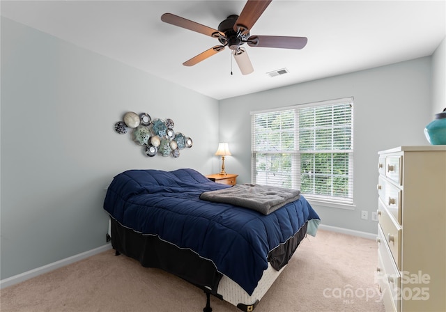 bedroom with carpet, baseboards, and a ceiling fan