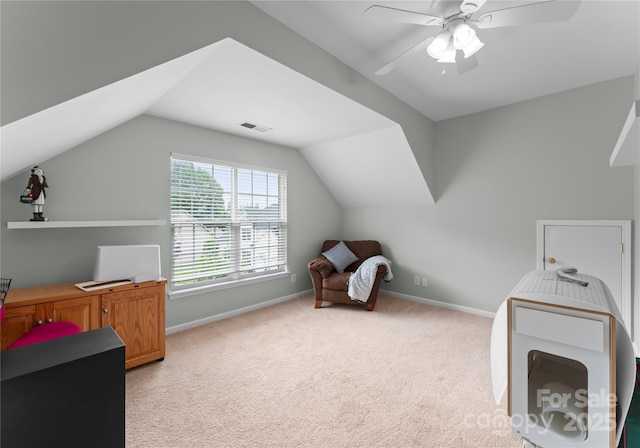 additional living space with light carpet, baseboards, lofted ceiling, and a ceiling fan