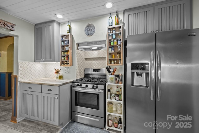 3905 NC Highway 213, Marshall, NC 28753 - kitchen with stainless steel appliances, under cabinet range hood, gray cabinets, tasteful backsplash, and light stone counters