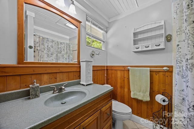 3905 NC Highway 213, Marshall, NC 28753 - full bathroom featuring a wainscoted wall, wood walls, toilet, vanity, and tile patterned floors