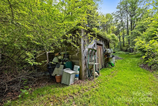3905 NC Highway 213, Marshall, NC 28753 - view of green lawn featuring an outdoor structure and a storage shed