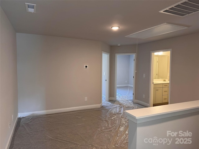4041 Port Richmond Ave Unit 9, Gastonia, NC 28056 - spare room featuring attic access and baseboards