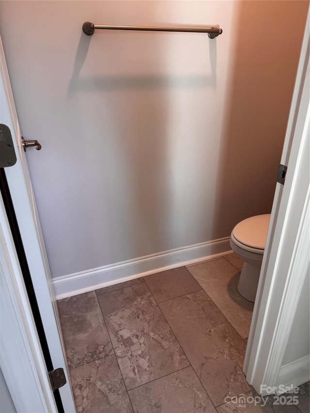 4041 Port Richmond Ave Unit 9, Gastonia, NC 28056 - bathroom with baseboards, marble finish flooring, and toilet