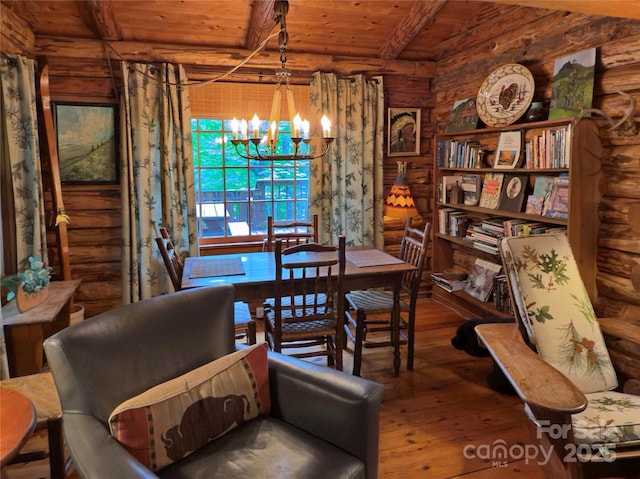 615 Sweetwater Rdg, Burnsville, NC 28714 - dining room featuring a chandelier, hardwood / wood-style floors, log walls, and wood ceiling with exposed beams