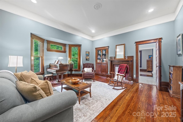 4569 Edgeland Rd, Edgemoor, SC 29712 - living area featuring hardwood / wood-style floors, recessed lighting, baseboards, and a brick fireplace