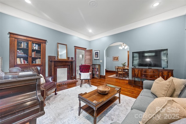 4569 Edgeland Rd, Edgemoor, SC 29712 - living room featuring arched walkways, recessed lighting, wood finished floors, and baseboards