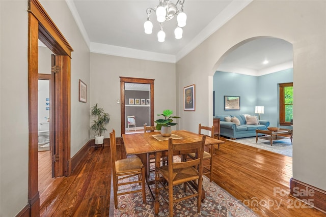 4569 Edgeland Rd, Edgemoor, SC 29712 - dining area with arched walkways, wood-type flooring, ornamental molding, and baseboards