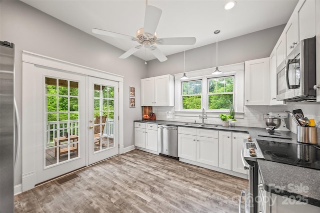 4569 Edgeland Rd, Edgemoor, SC 29712 - kitchen with appliances with stainless steel finishes, a sink, decorative backsplash, french doors, and white cabinets