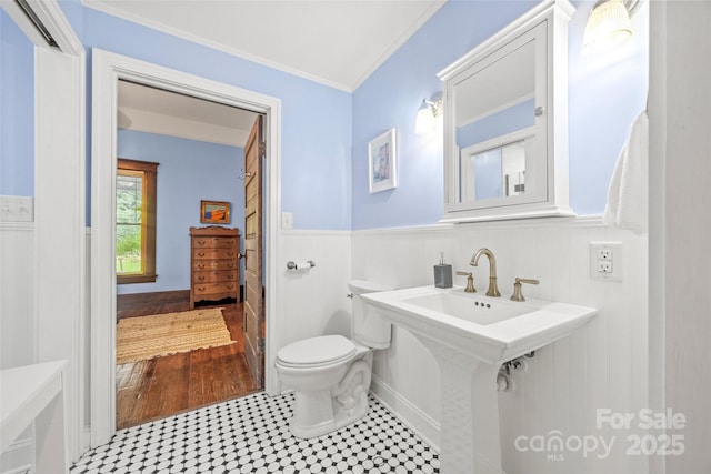 4569 Edgeland Rd, Edgemoor, SC 29712 - bathroom with crown molding, toilet, and a wainscoted wall