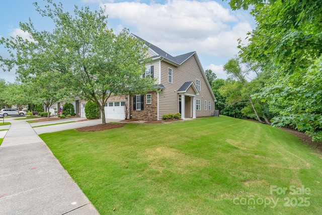 11945 Red Rust Ln, Charlotte, NC 28277 - view of front of home with concrete driveway, a front yard, stone siding, and a garage