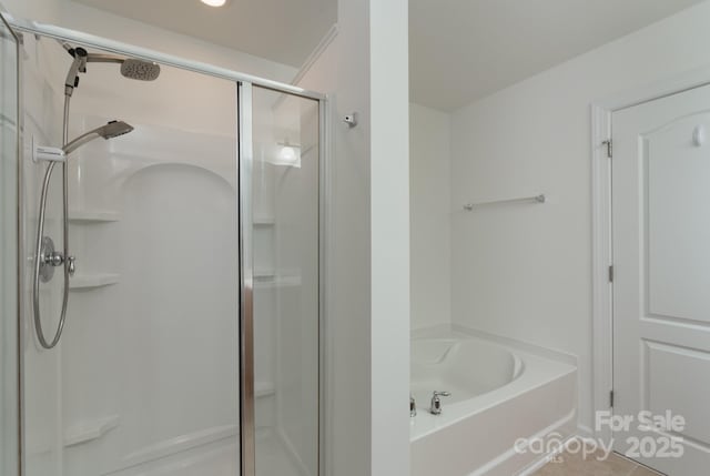11945 Red Rust Ln, Charlotte, NC 28277 - bathroom featuring a stall shower, a garden tub, and tile patterned flooring