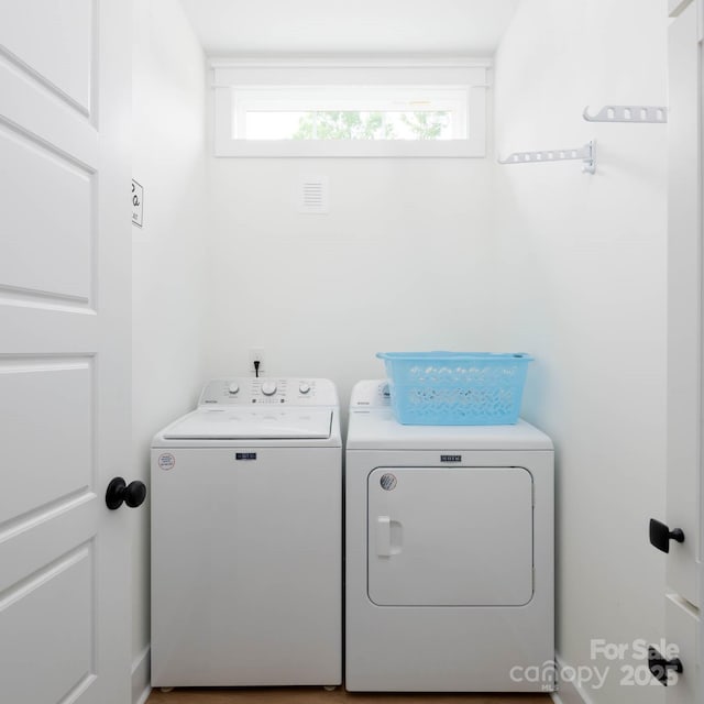washroom featuring washing machine and dryer