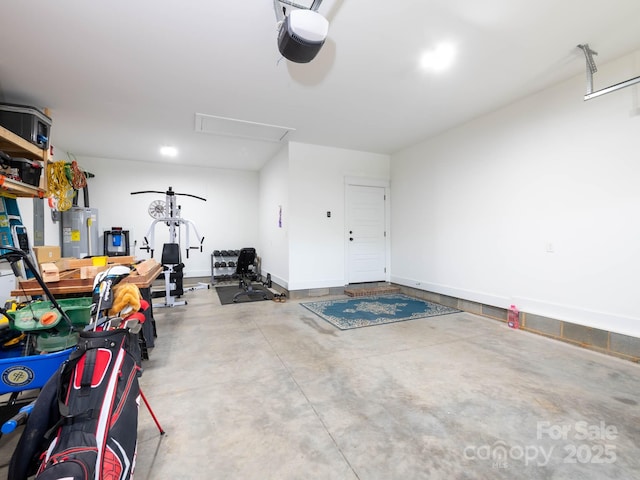 garage featuring electric water heater and a garage door opener