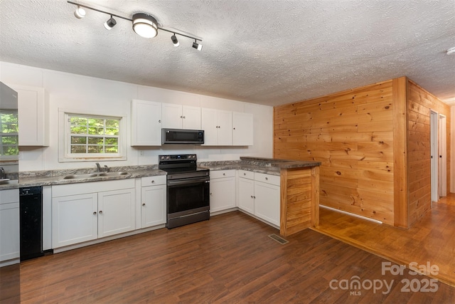 116 Hidden Meadow Dr Unit 17, Candler, NC 28715 - kitchen featuring appliances with stainless steel finishes, a textured ceiling, white cabinets, a sink, and dark wood-type flooring