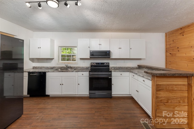116 Hidden Meadow Dr Unit 17, Candler, NC 28715 - kitchen featuring appliances with stainless steel finishes, a sink, dark wood-style floors, white cabinetry, and a textured ceiling