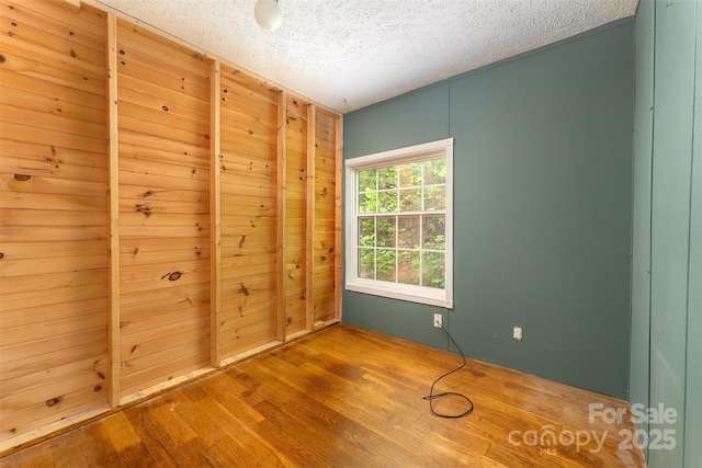 116 Hidden Meadow Dr Unit 17, Candler, NC 28715 - unfurnished bedroom featuring a textured ceiling and wood finished floors