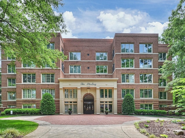 2445 Selwyn Ave Unit 104, Charlotte, NC 28209 - view of building exterior featuring decorative driveway