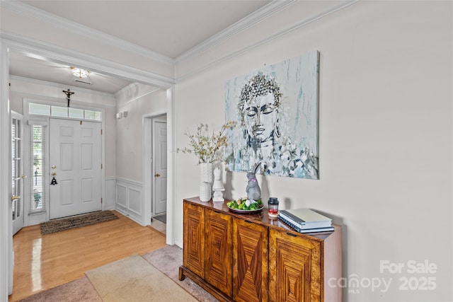 8410 Darcy Hopkins Dr, Charlotte, NC 28277 - foyer with wood finished floors, ornamental molding, and a wainscoted wall