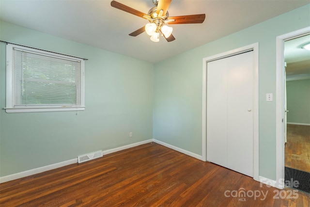 49 Jeffress Ave, Asheville, NC 28803 - unfurnished bedroom featuring wood finished floors, ceiling fan, and a closet