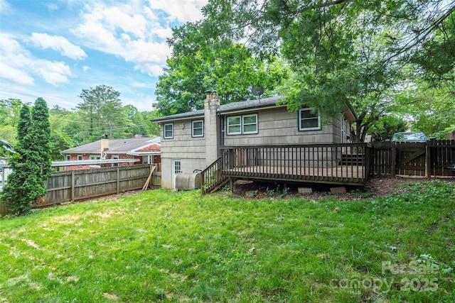 49 Jeffress Ave, Asheville, NC 28803 - back of property featuring a deck, a chimney, a fenced backyard, and a gate