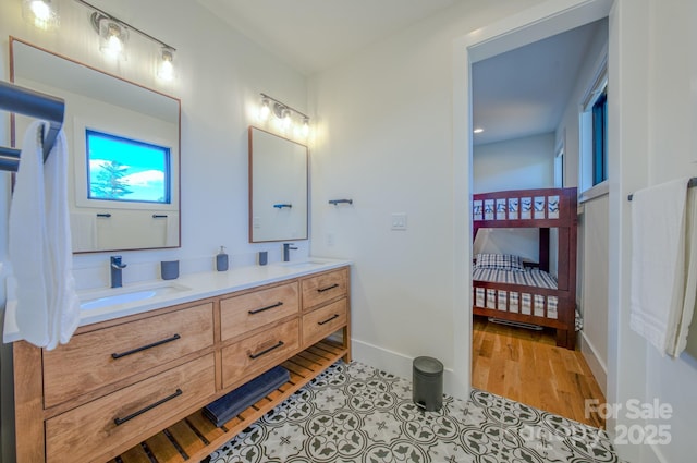 223 Linville View Dr, Nebo, NC 28761 - bathroom with double vanity, baseboards, and wood finished floors