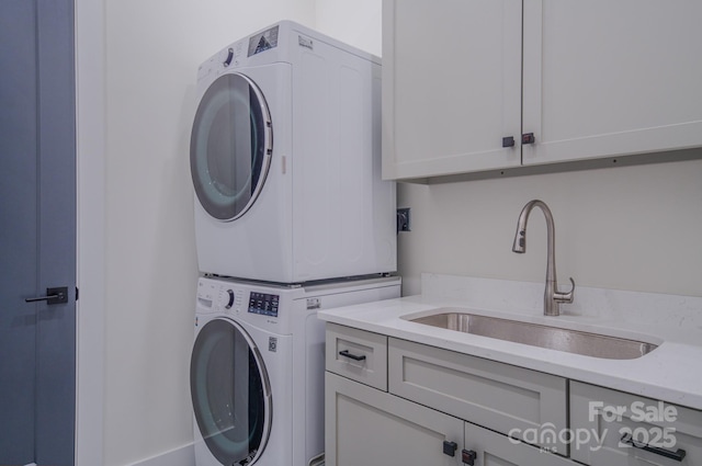 223 Linville View Dr, Nebo, NC 28761 - laundry area featuring stacked washing machine and dryer and cabinet space