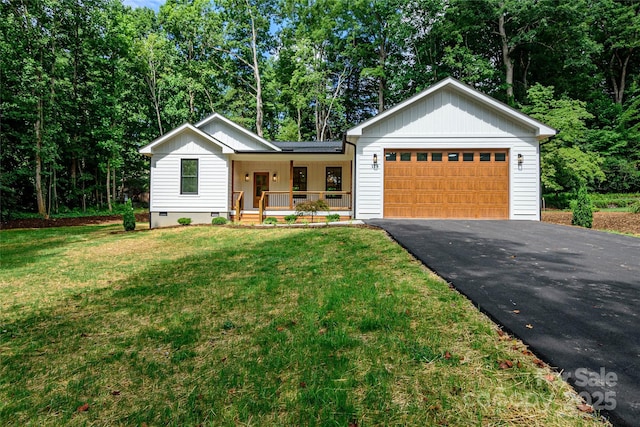 118 W Laurel Ln, Etowah, NC 28729 - view of front of property with a porch, driveway, board and batten siding, an attached garage, and a front lawn