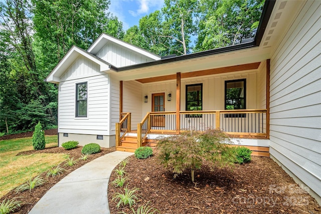 118 W Laurel Ln, Etowah, NC 28729 - view of front of house featuring board and batten siding, a porch, and crawl space