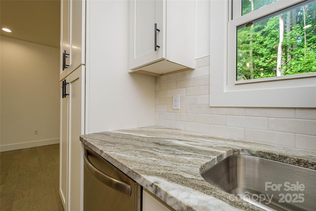118 W Laurel Ln, Etowah, NC 28729 - kitchen with stainless steel dishwasher, light stone countertops, white cabinetry, tasteful backsplash, and recessed lighting