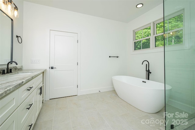 118 W Laurel Ln, Etowah, NC 28729 - bathroom featuring vanity, a soaking tub, recessed lighting, and tile patterned floors