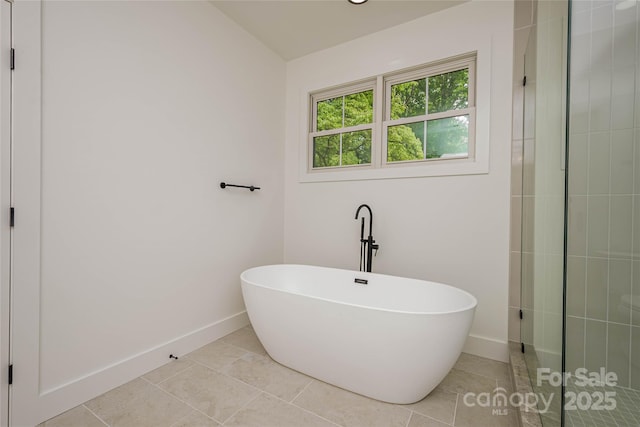 118 W Laurel Ln, Etowah, NC 28729 - full bathroom featuring a soaking tub, tile patterned floors, and a tile shower