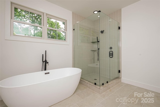 118 W Laurel Ln, Etowah, NC 28729 - bathroom featuring a freestanding bath, tile patterned flooring, and a stall shower