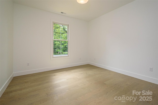 118 W Laurel Ln, Etowah, NC 28729 - empty room featuring wood finished floors and baseboards