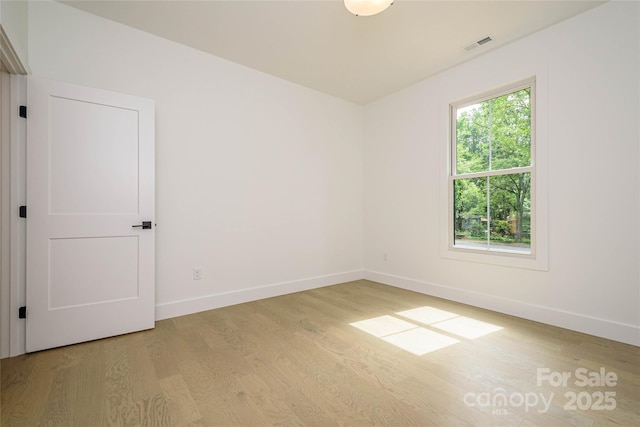 118 W Laurel Ln, Etowah, NC 28729 - unfurnished room with light wood-type flooring and baseboards