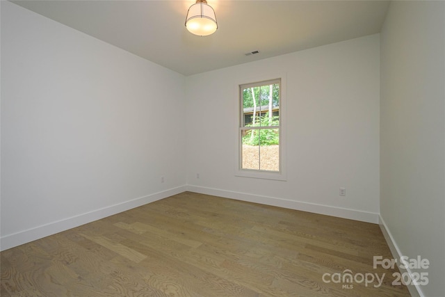 118 W Laurel Ln, Etowah, NC 28729 - unfurnished room with wood finished floors and baseboards