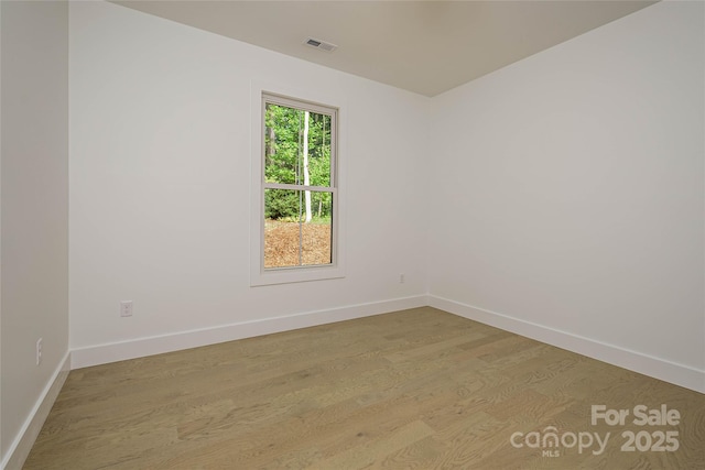 118 W Laurel Ln, Etowah, NC 28729 - empty room with baseboards and light wood-type flooring
