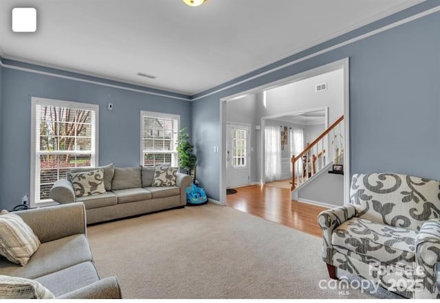 10515 Greenhead View Rd, Charlotte, NC 28262 - living room featuring carpet, crown molding, healthy amount of natural light, and stairway