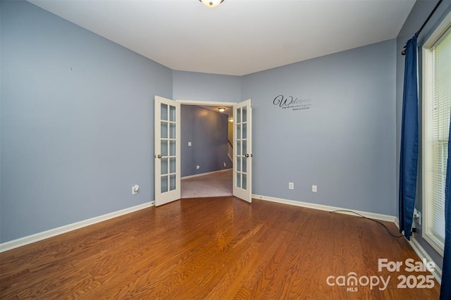 10515 Greenhead View Rd, Charlotte, NC 28262 - empty room featuring french doors, wood finished floors, and baseboards
