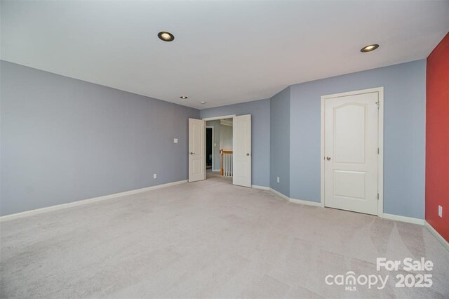10515 Greenhead View Rd, Charlotte, NC 28262 - unfurnished room with baseboards, light carpet, and recessed lighting
