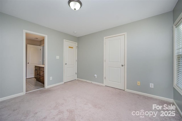 10515 Greenhead View Rd, Charlotte, NC 28262 - unfurnished bedroom featuring carpet flooring, baseboards, and ensuite bath
