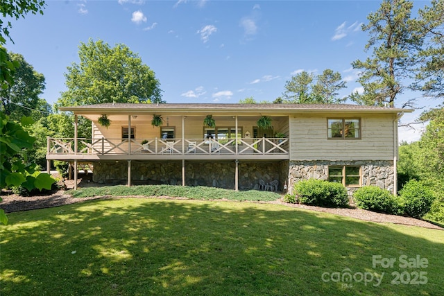 16 Royal Rdg, Clyde, NC 28721 - rear view of house featuring a yard, stone siding, and a deck